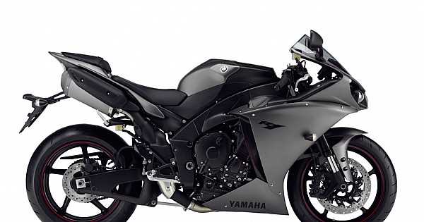 Yamaha YZF-R1 оснащается 998-кубовым рядным четырехцилиндровым двигателем Crossplane, выдающим 200 л.с. при 13 500 об/мин и 112,4 Н·м крутящего момента. Для сравнения: Kawasaki Ninja ZX-10RR с таким же объемом генерирует 203 л.с. при 13 200 об/мин, но отличается более линейной кривой мощности благодаря камерам с изменяемыми фазами газораспределения. BMW S1000RR (999 см³) превосходит оба мотоцикла по пиковой мощности – 207 л.с. при 13 500 об/мин, однако его крутящий момент (113 Н·м) распределяется менее равномерно, что требует более точного управления дросселем на низких оборотах.